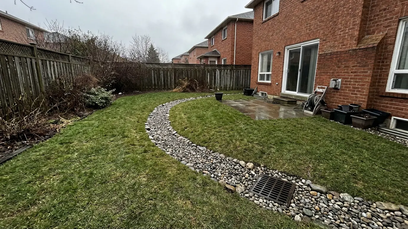 After: Drainage solutions | Music City Hardscape After: a yard with a graded, drained yard with a dry creek bed